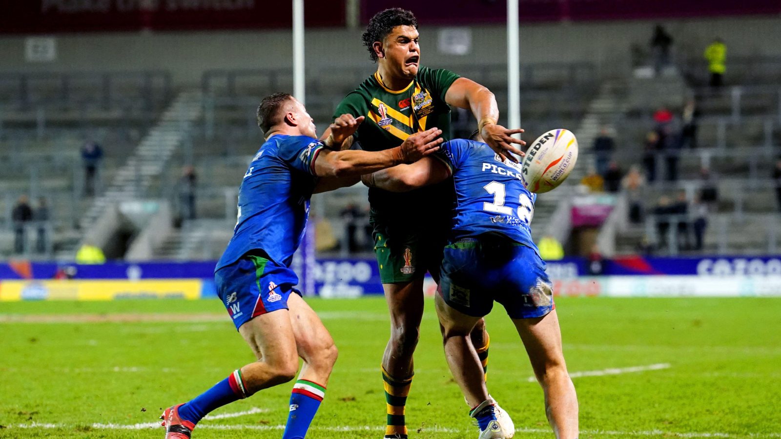 Italy's Kyle Pickering tackling Australia's Latrell Mitchell Alamy